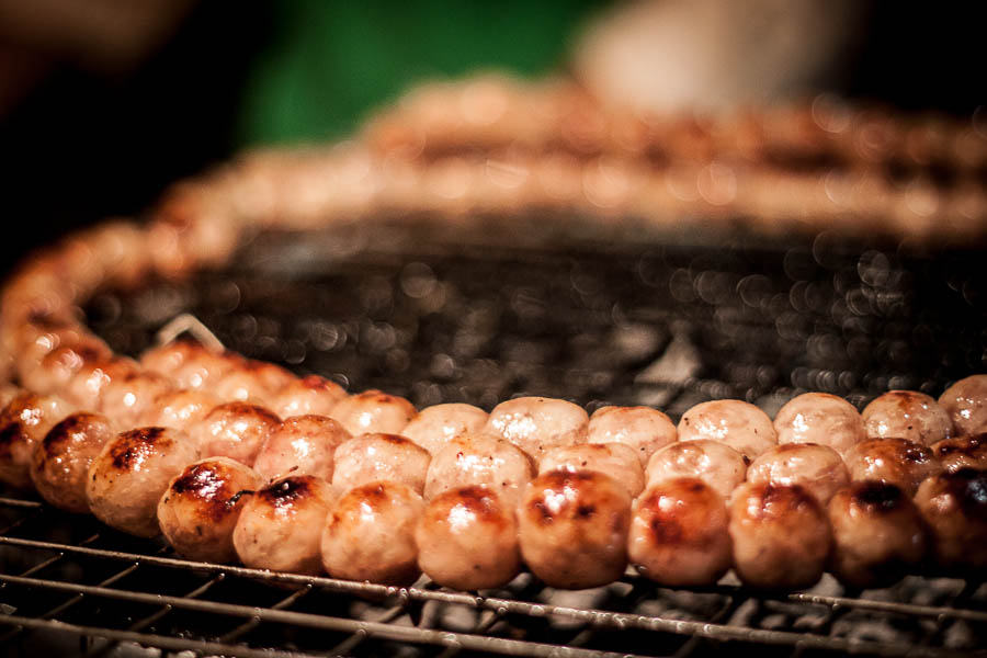 Sai Oua on the barbeque in Chiang Mai. The only mystery here is how something so simple can be so delicious!