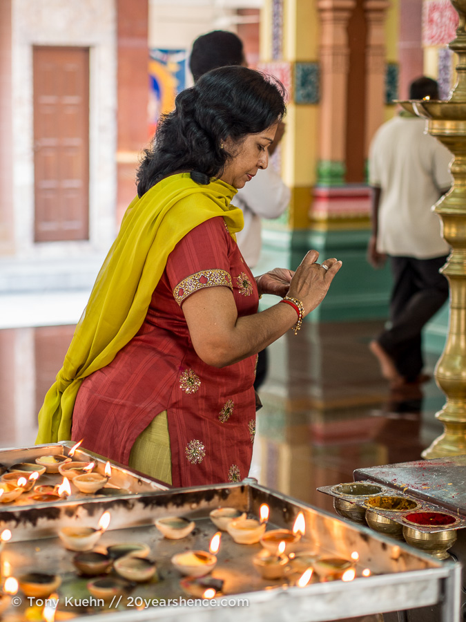 Lady making offering at Sri Mahamariamman