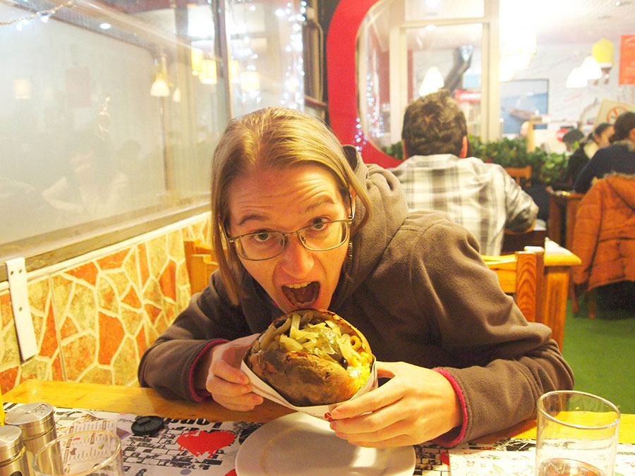 Rachel eating a kumpir (loaded baked potato) in Ankara.