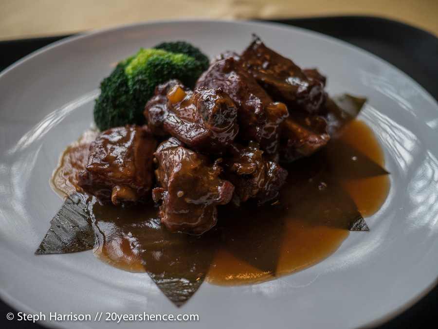 Sticky braised spare ribs on bamboo leaves