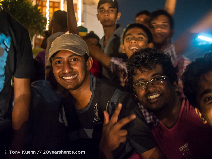 A dumptruck-full of happy Sri Lankans